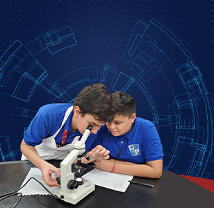 Two boys looking through a microscope